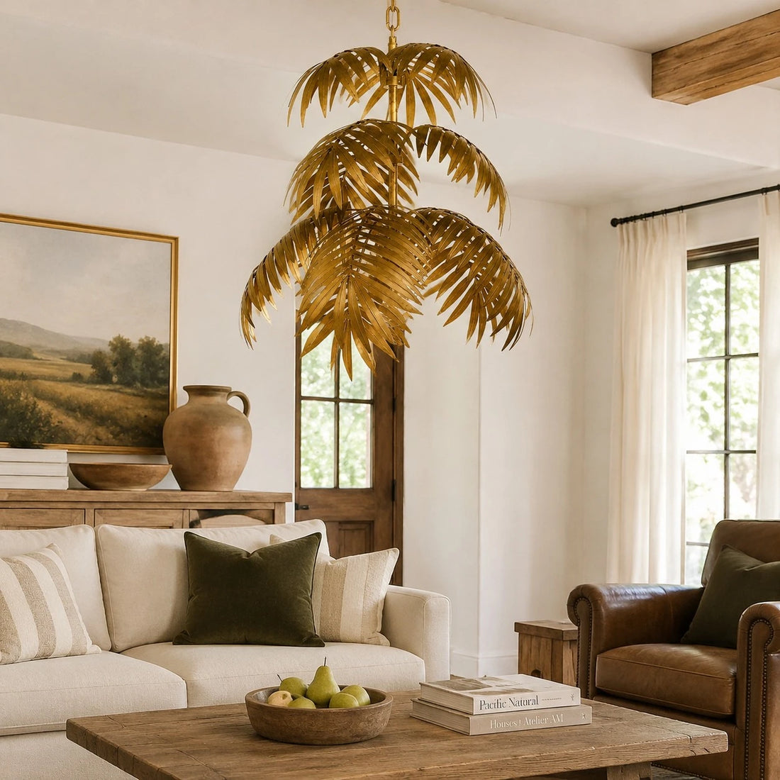 Gold palm leaf chandelier in a warm living room
