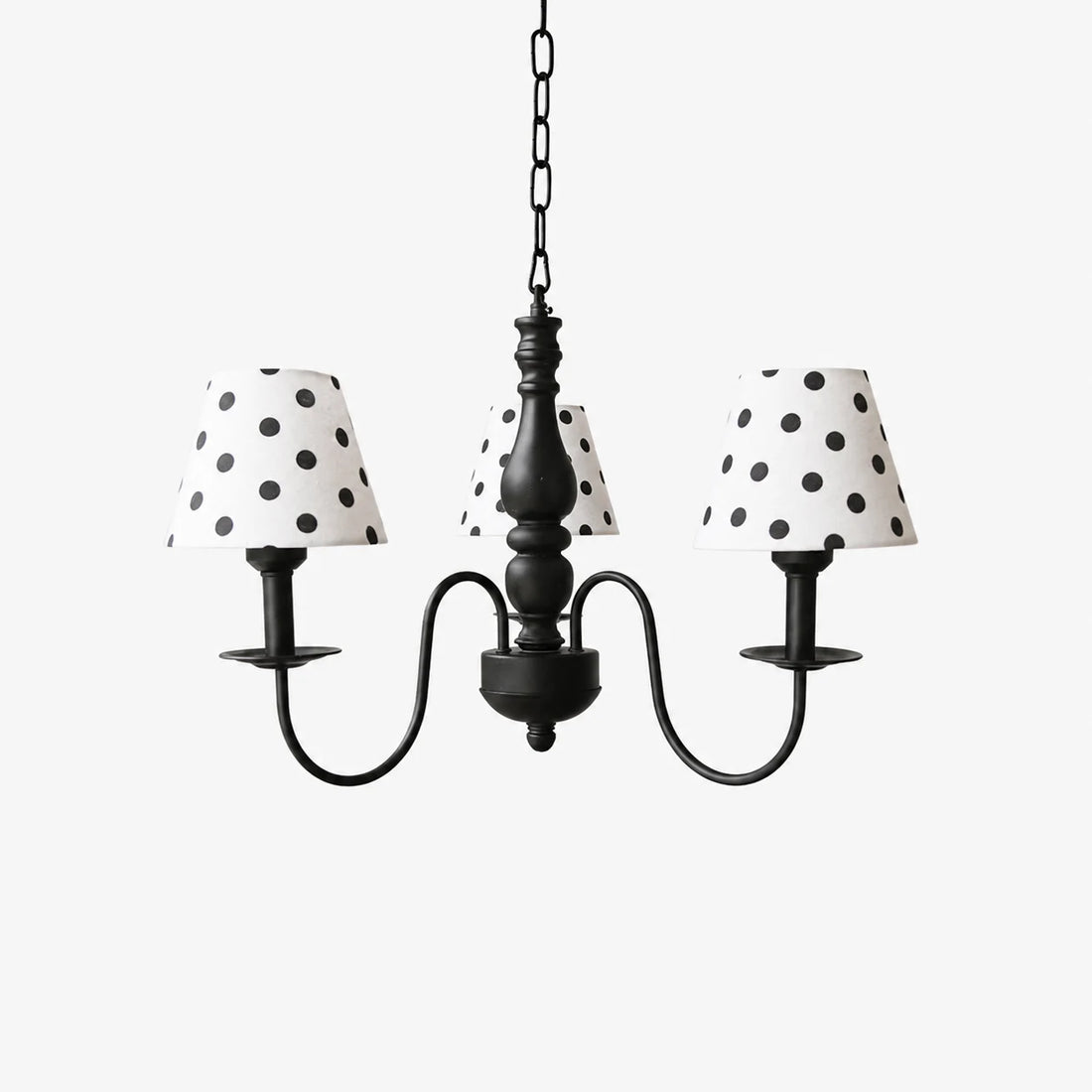 Three-light black chandelier with cream polka dot fabric shades