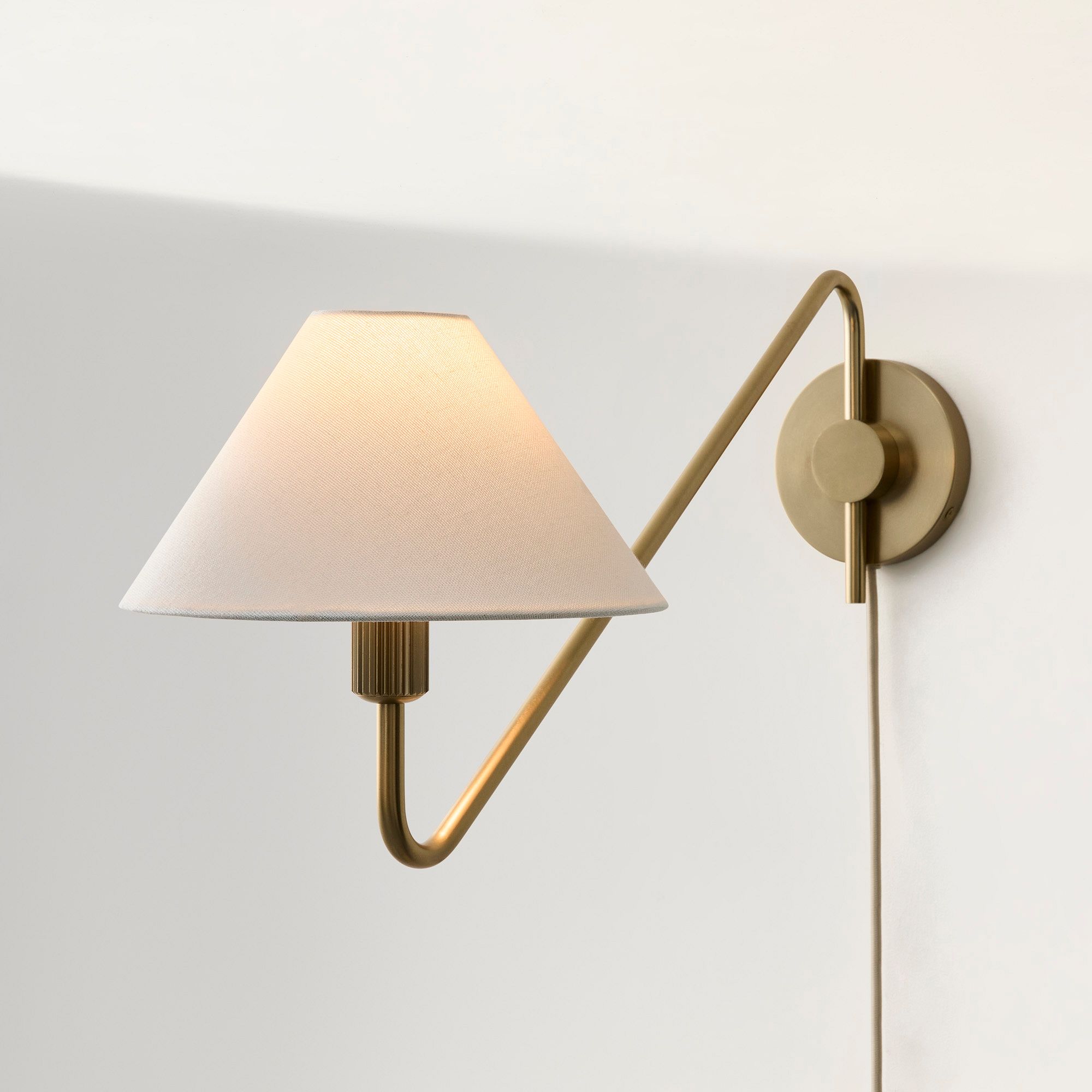 Diora Champagne Bronze Sconce - Plug-In Adjustable Arm Linen Bedside Lamp