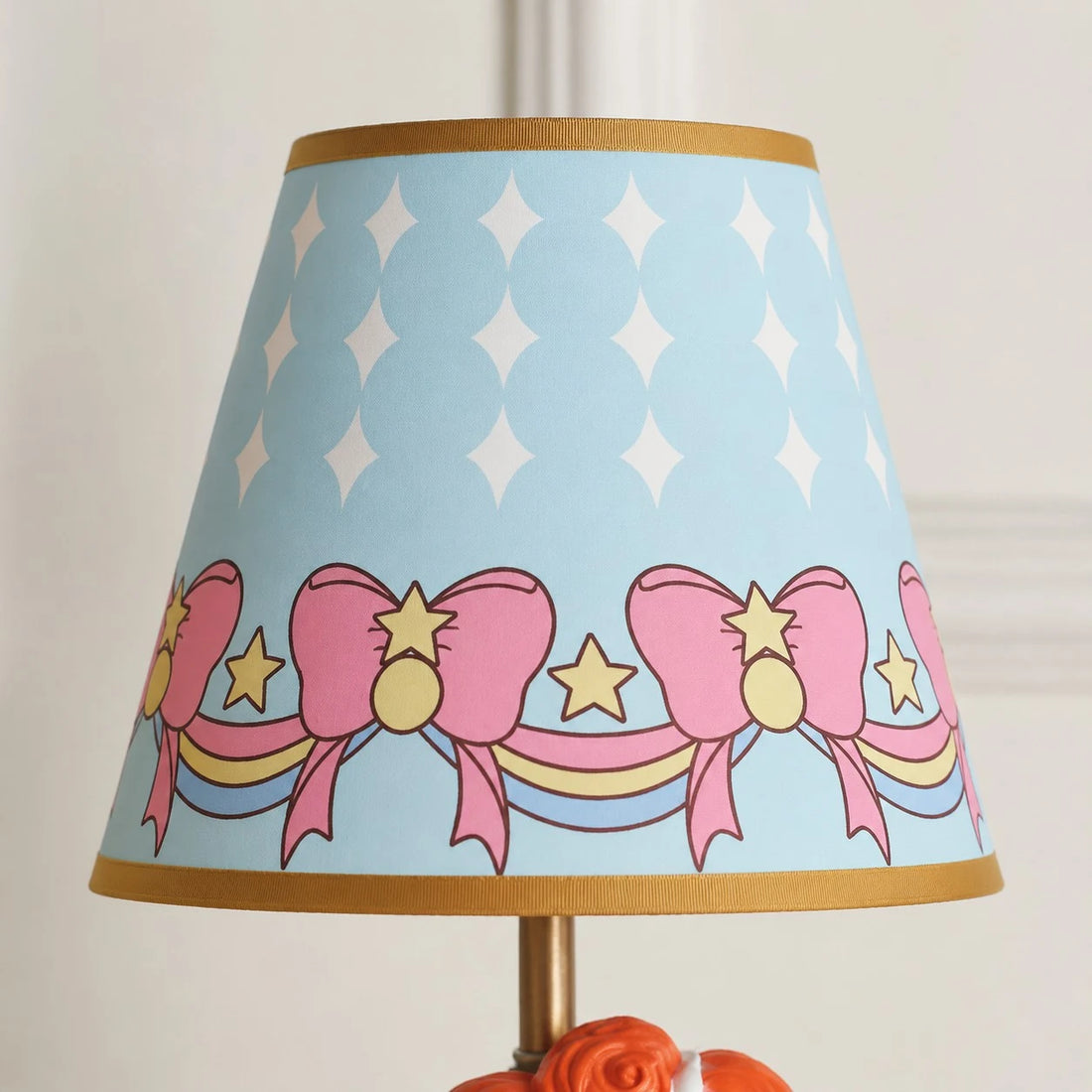 Blue printed fabric shade detail with bows and stars