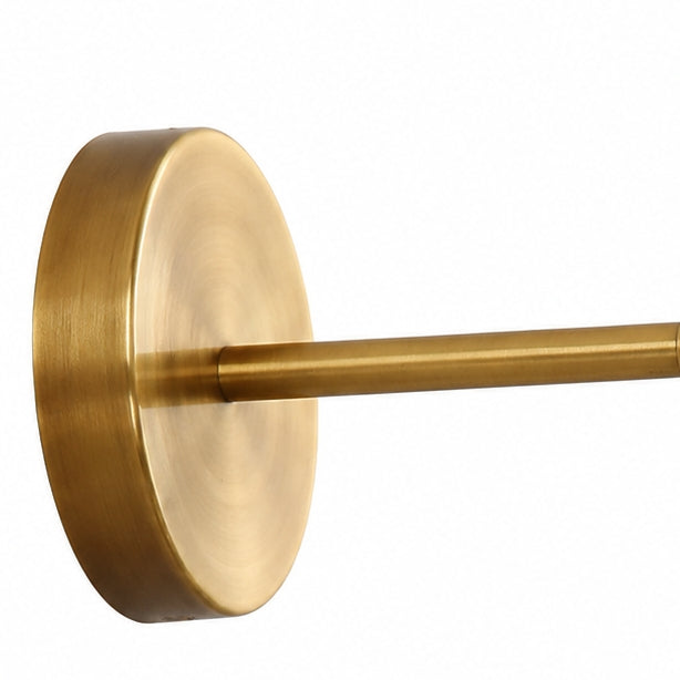 Round antique brass wall plate and straight arm detail