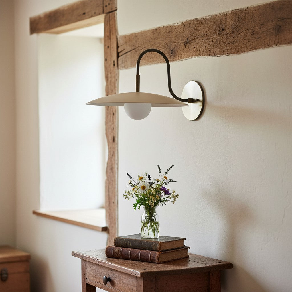 Curva Metal Modern Wall Sconce - Antique Brass Arm with Cream Disc Shade