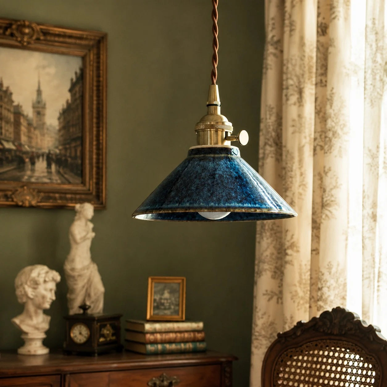 Blue glazed ceramic pendant light in a classic reading corner
