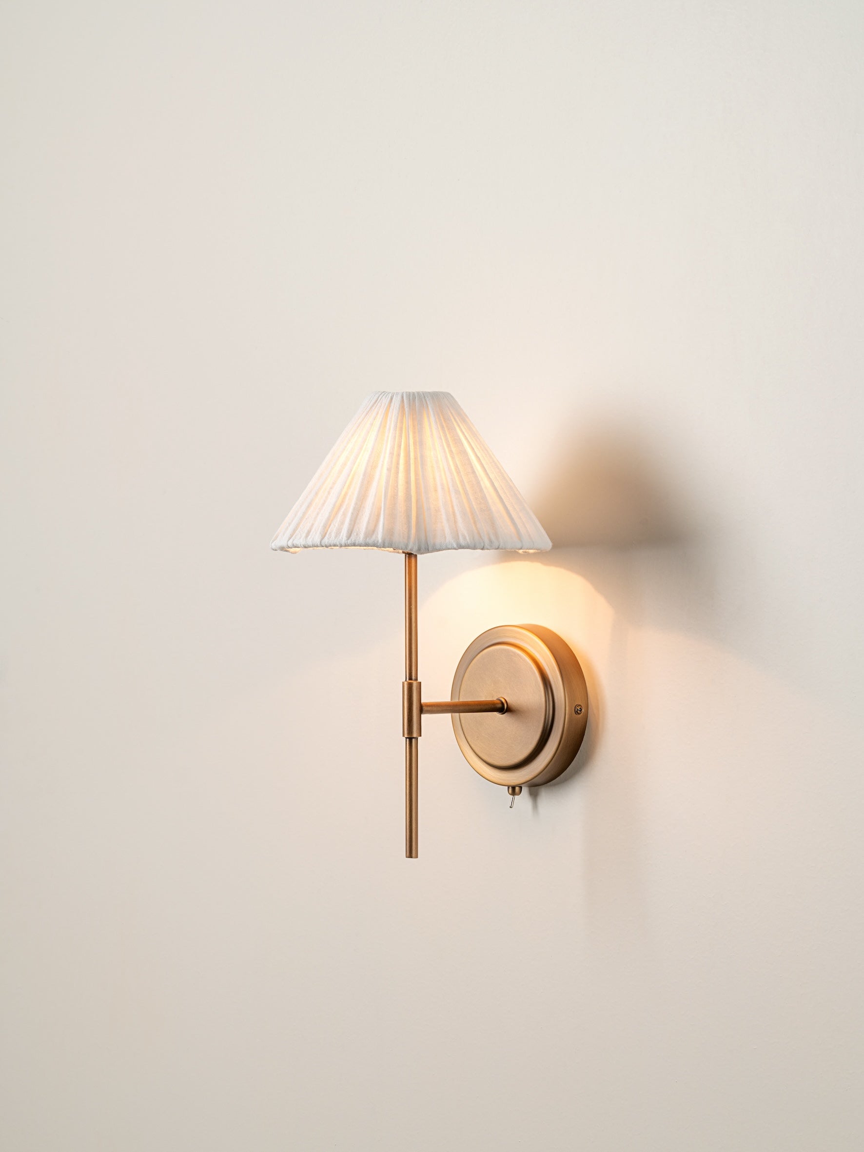 Lindi - Aged Brass and Linen Scalloped Wall Light