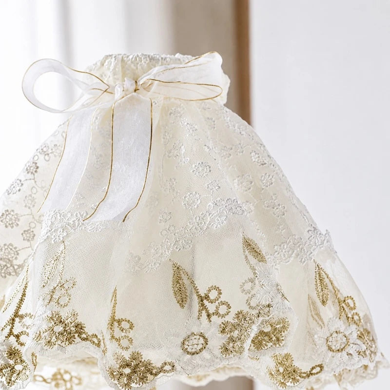 Embroidered lace lampshade with bow and floral stitching detail