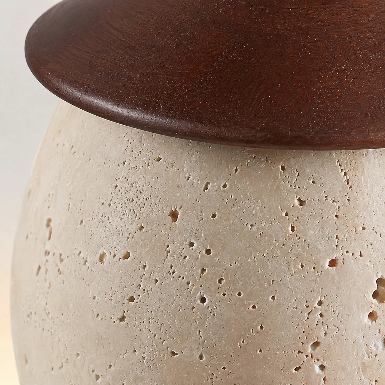 Stone texture and dark top fitting rim close-up