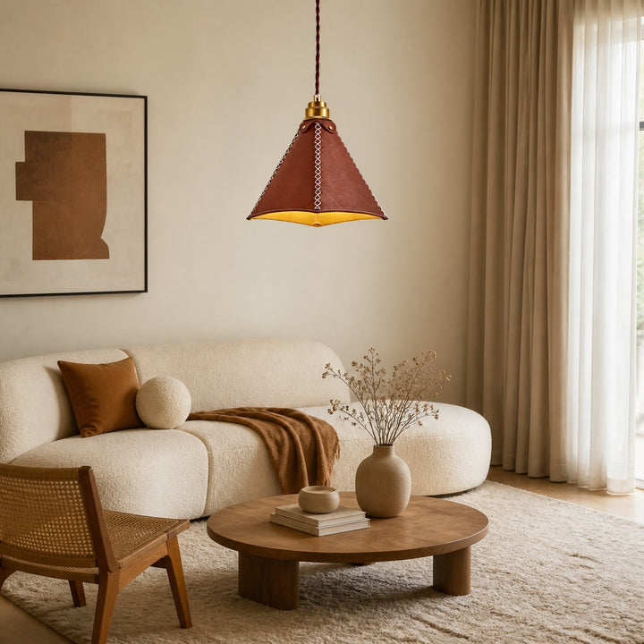 Leather pendant light installed above a warm living room seating area