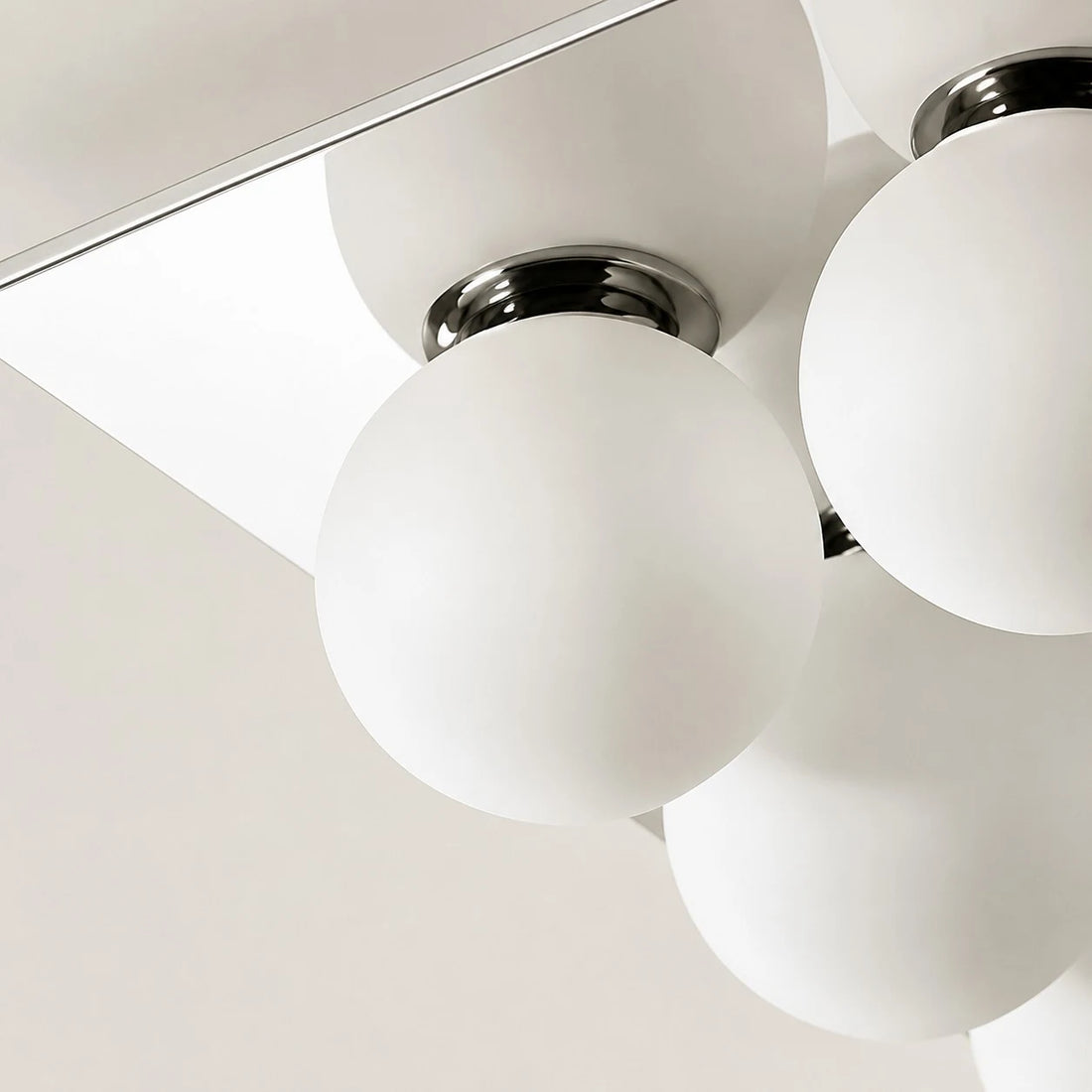 Detail image: close view of chrome fitting and glass diffuser.