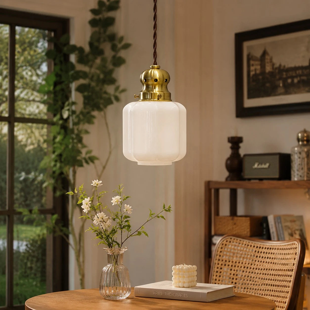 White glass pendant lamp in a cozy window corner