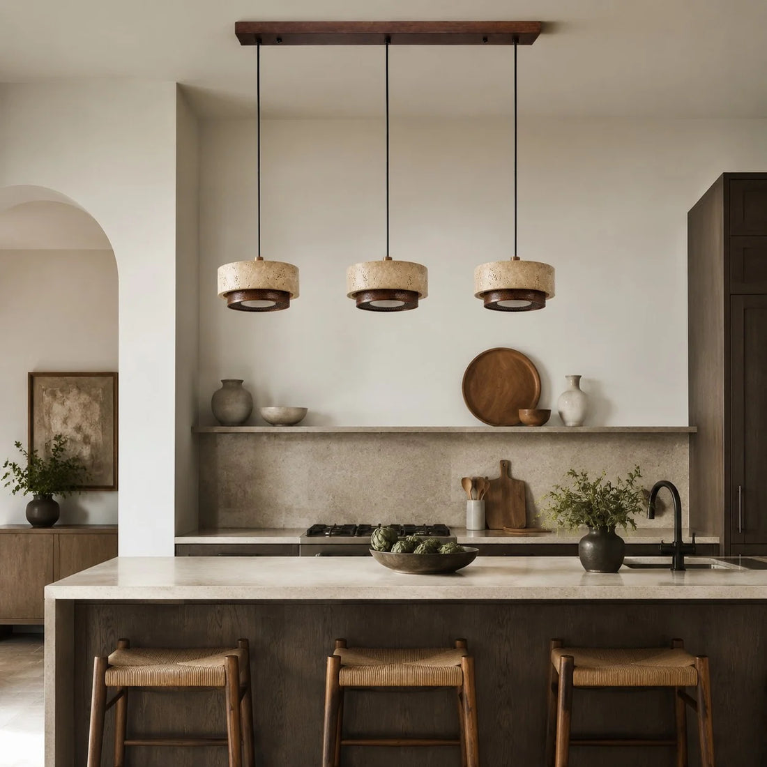 three head travertine pendant light over a kitchen island
