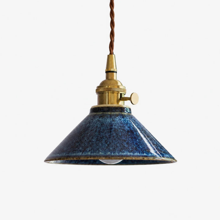 Blue ceramic shade with brass tone socket hardware