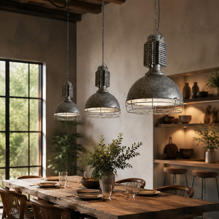 Industrial cage pendant lights styled over a dining table