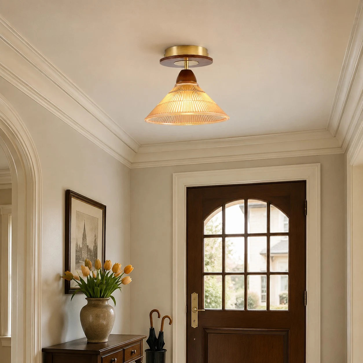 Amber flush mount ceiling light near an arched doorway
