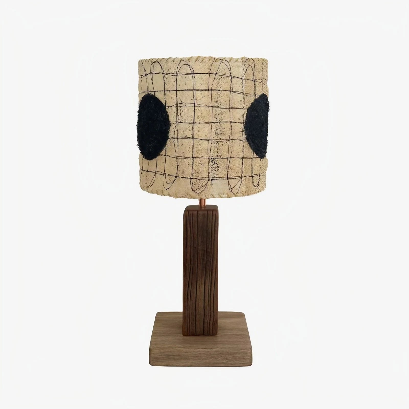 Black dot shade loofah table lamp on a white background